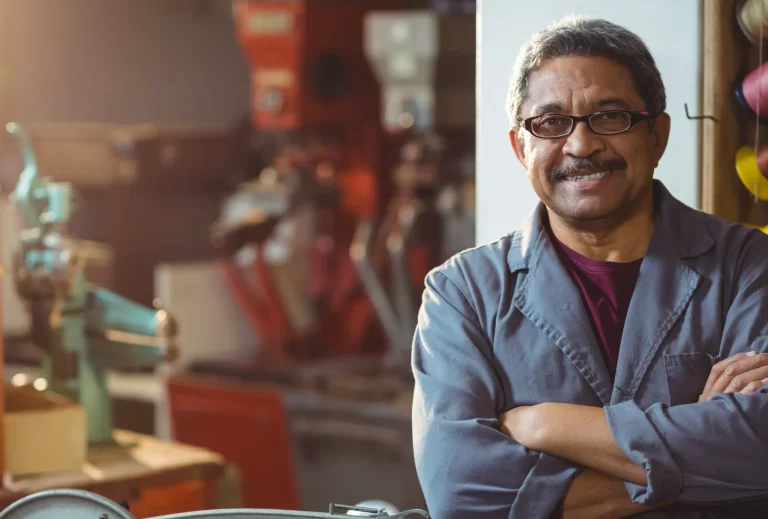 Portrait of man standing with arms crossed